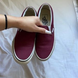 Burgundy slip on Vans.